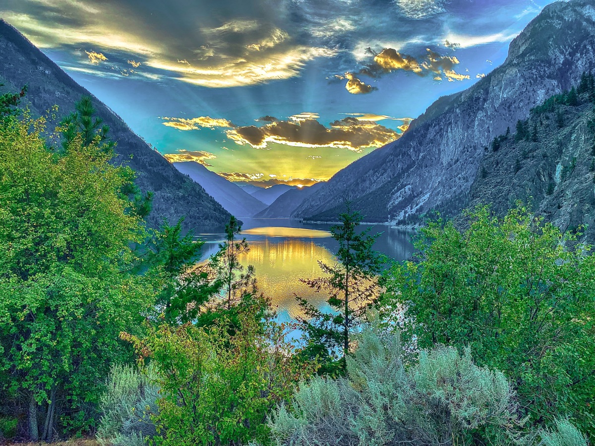 Sunbeams breaking over Duffey Lake, mountains mirrored in still water — "Duffey Lake Sunset", a fine art print by Matthew Archer
