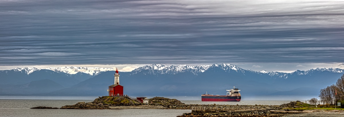 A wide panorama: the lighthouse, a passing ship, and the Olympic Mountains — "Fisgard Lighthouse", a fine art print by Matthew Archer